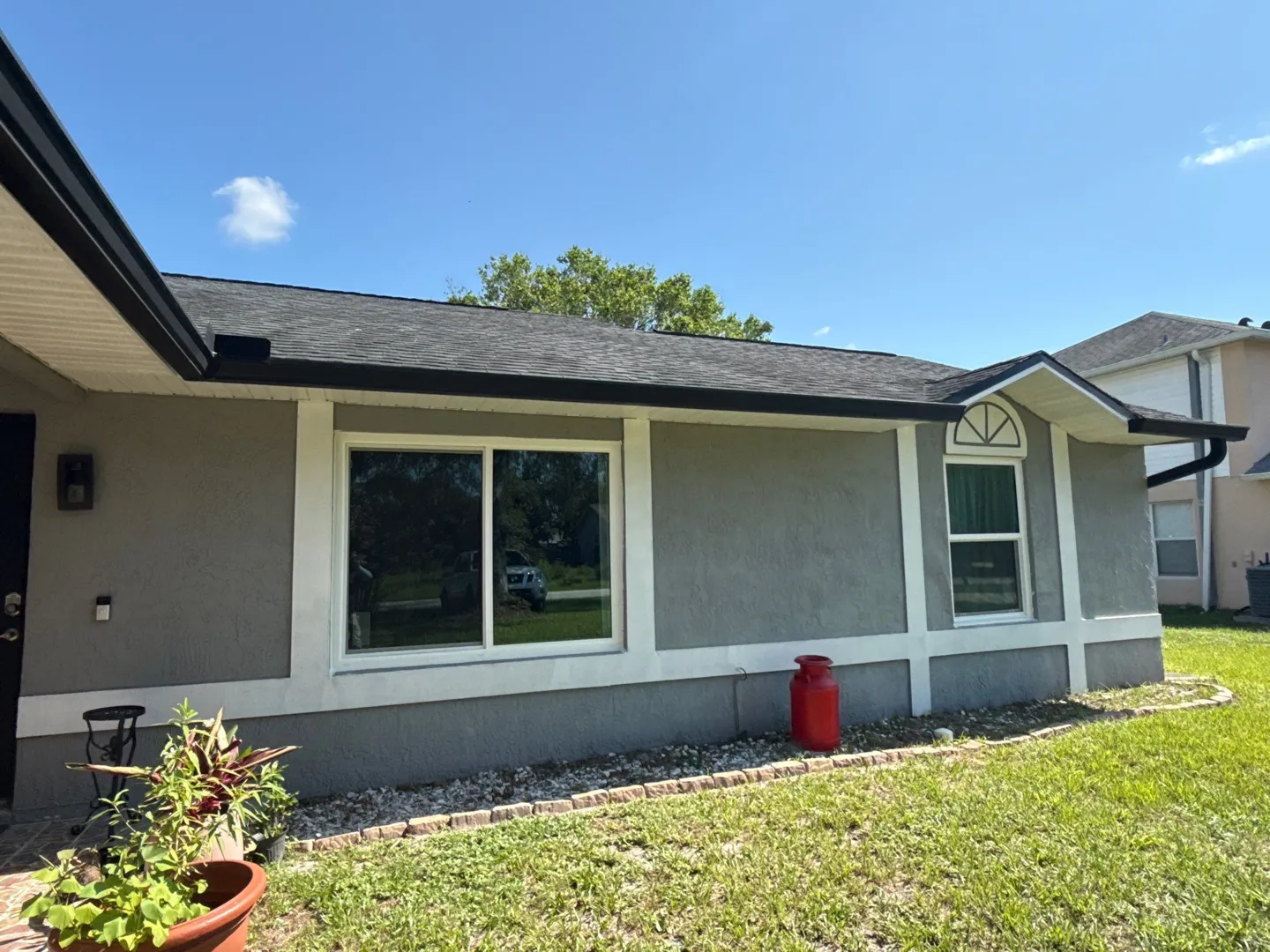 Deltona front: new white-framed windows